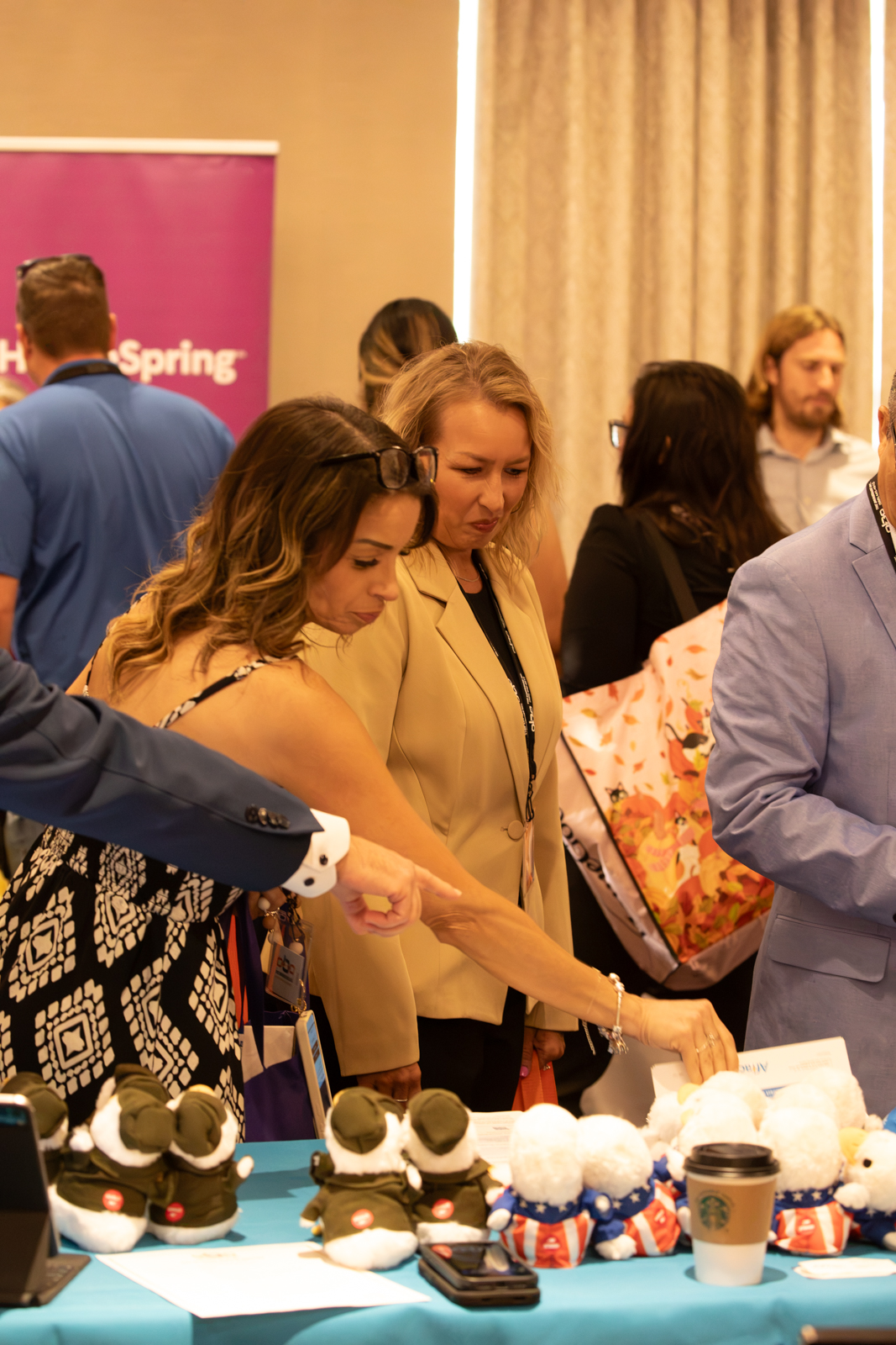 Attendees engaged in lively discussion and networking in the hospitality lounge