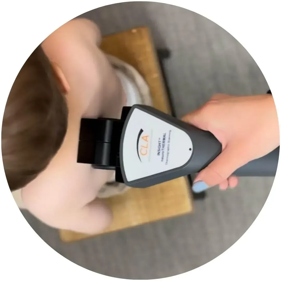 Thermal scan being performed on a child back.