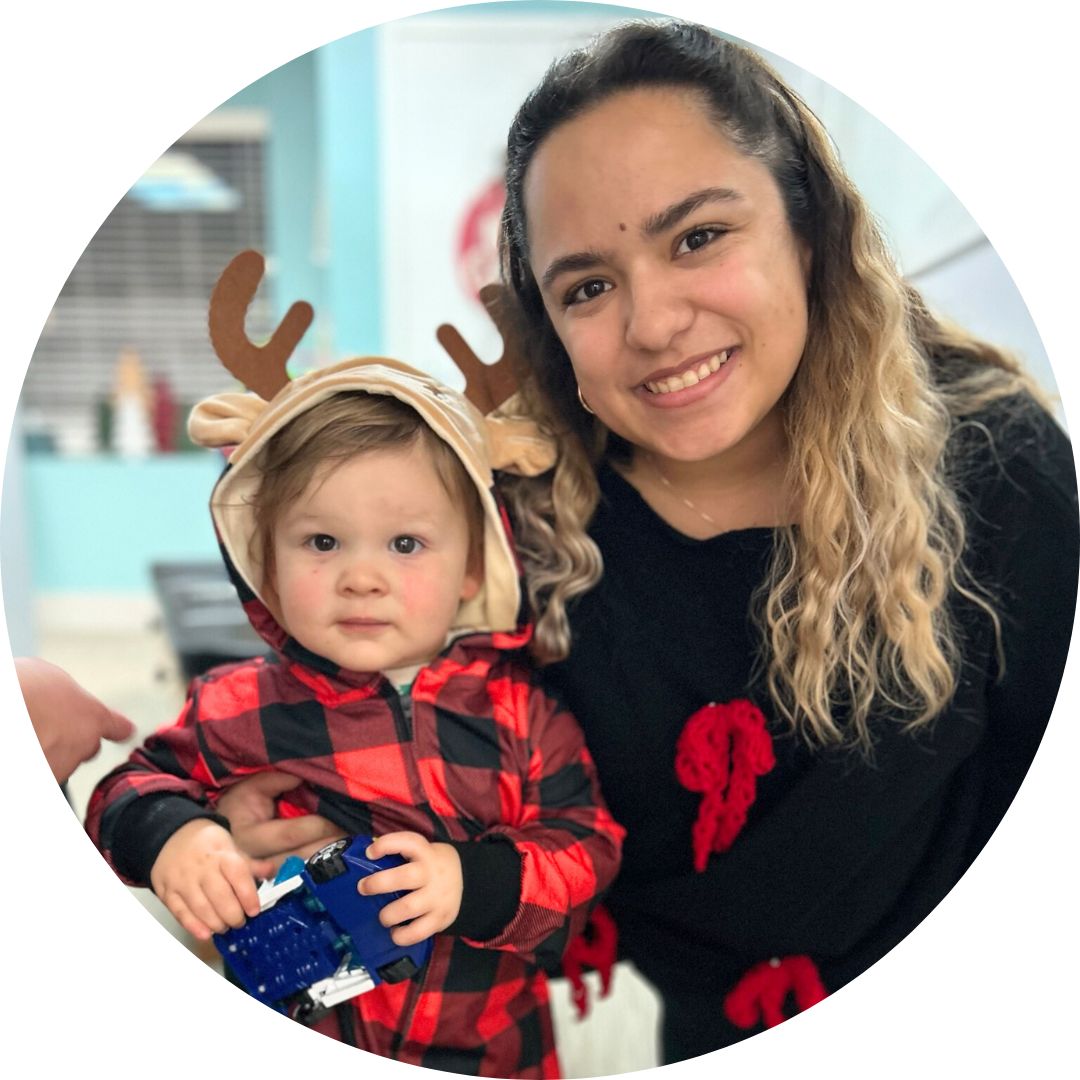 Pregnant woman receiving chiropractic care from a practitioner in a professional setting, highlighting prenatal health and comfort.
