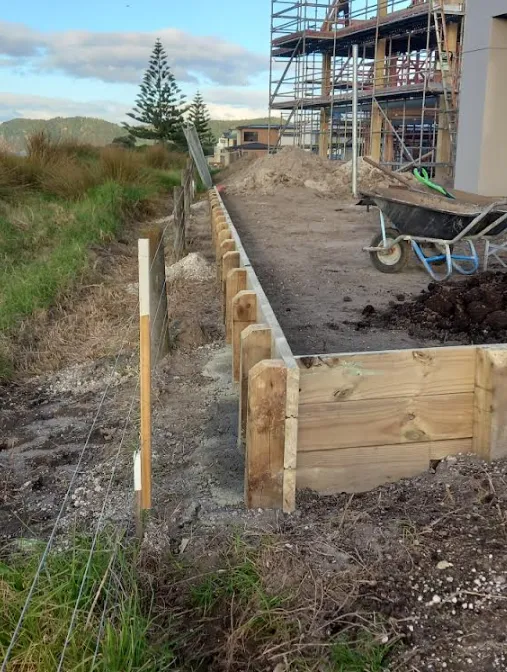 Retaining wall construction blending with landscaped slope