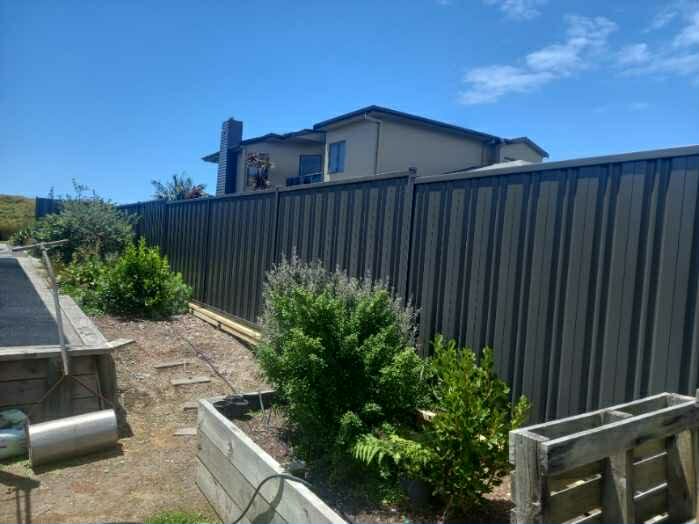 Black aluminium fencing around modern garden in Whakatane