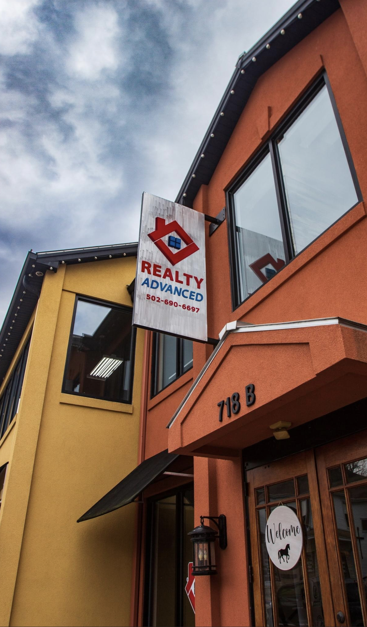 a modern house with a large front yard