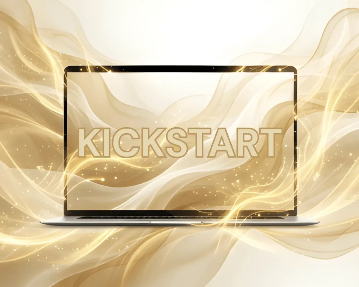 A laptop with the word KICKSTART on it, surrounded by gold waves
