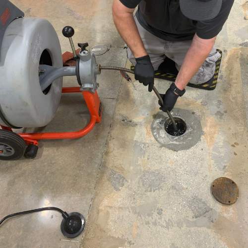 Plumber cleans out a residential sewer line in Spring Hill, ks