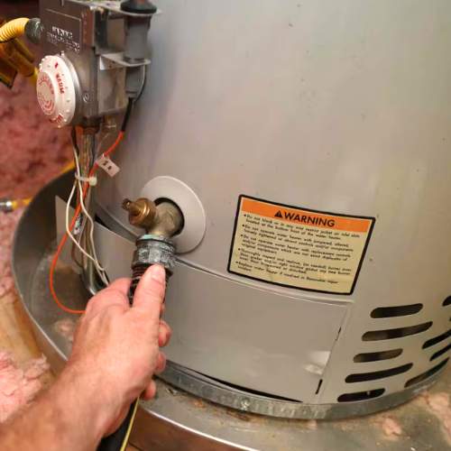 close up of a house ho water heater being repaired in Spring Hill, KS