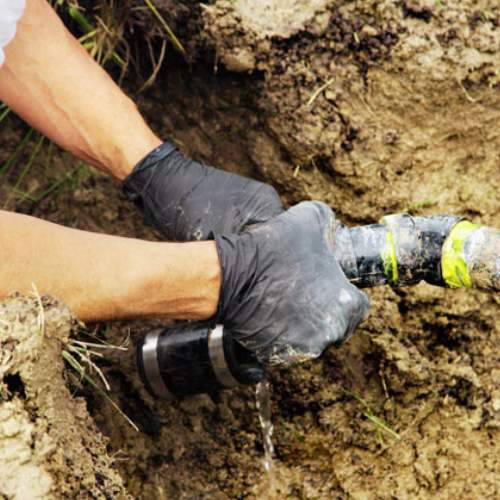 closeup of a sewer line showing it's break at the joint, in a front yard in spring hill, ks