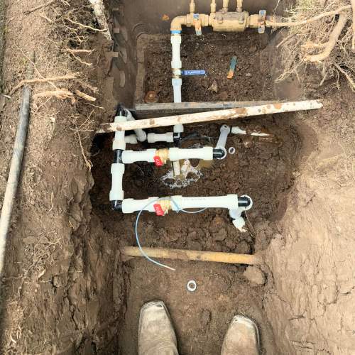 plumber taking a picture of a partial water line replacement at a spring hill, ks home
