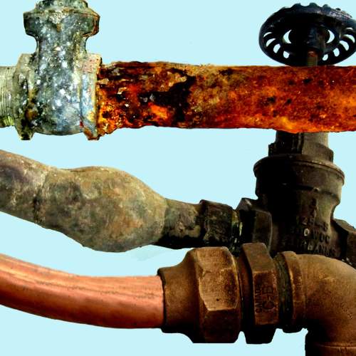 close up example of three pipe types that should be replaced in a water line replacement