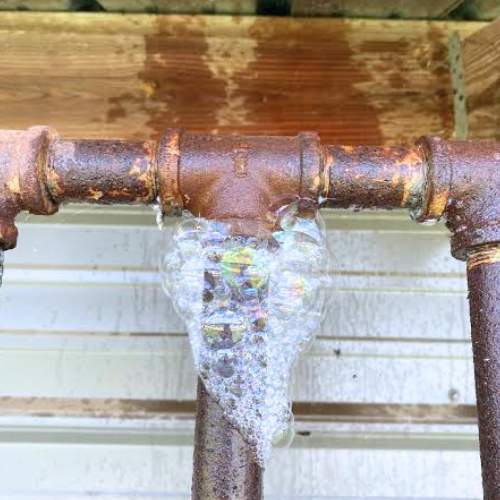 close up of a soap water test on a gas line that needs to be repaired in spring hill, ks