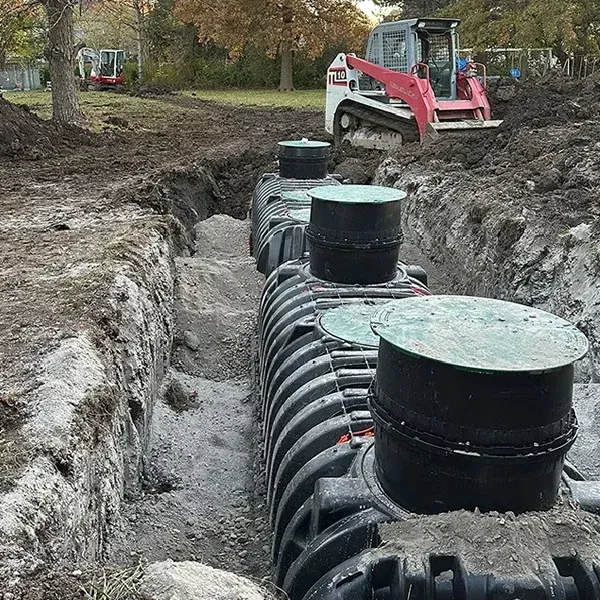 A Beemer Plumbing team installs a new septic system in spring hill.