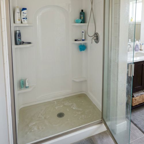 I nice, middle class bathroom in spring hill, ks. The picture focuses on the standing shower with the insert, but there is a 2 inches of shower water that is not draining like it should.