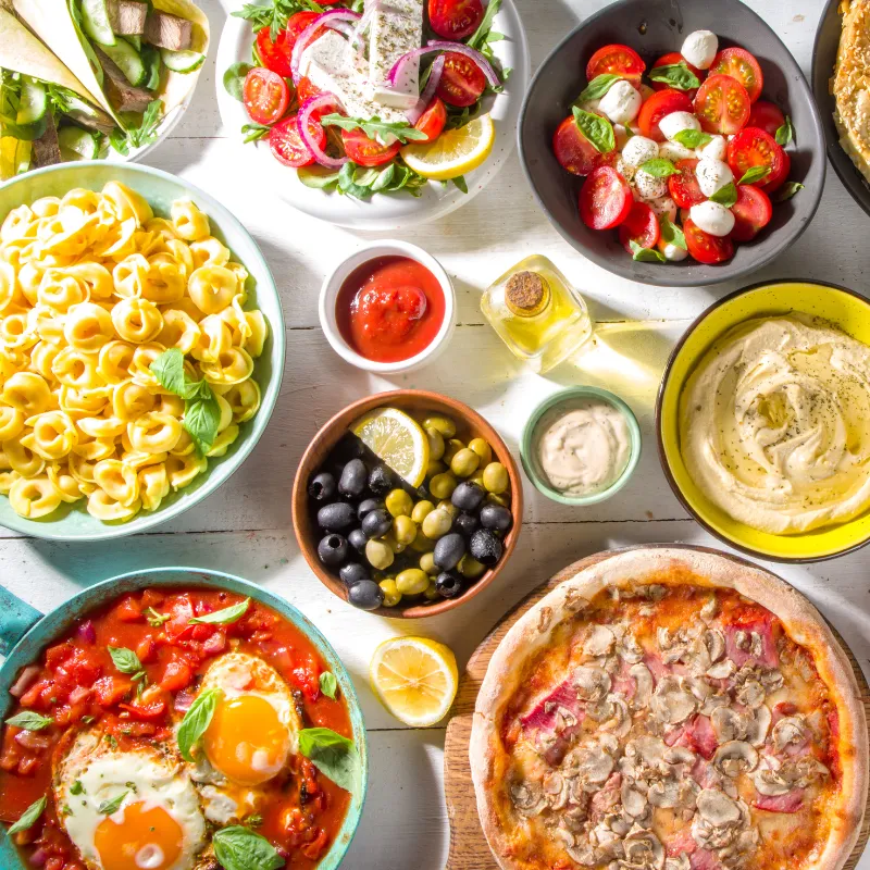 Assortment of colorful, healthy dishes symbolizing practical lessons for easier, more enjoyable everyday mom life