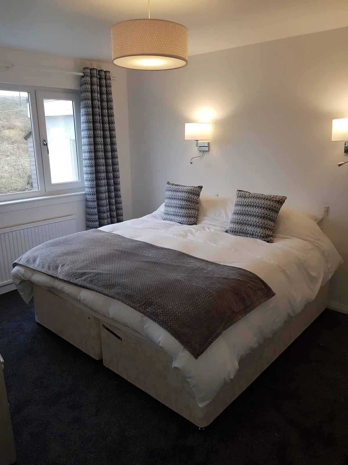 Bedroom 3 showing versatile superking bed and tranquil garden view