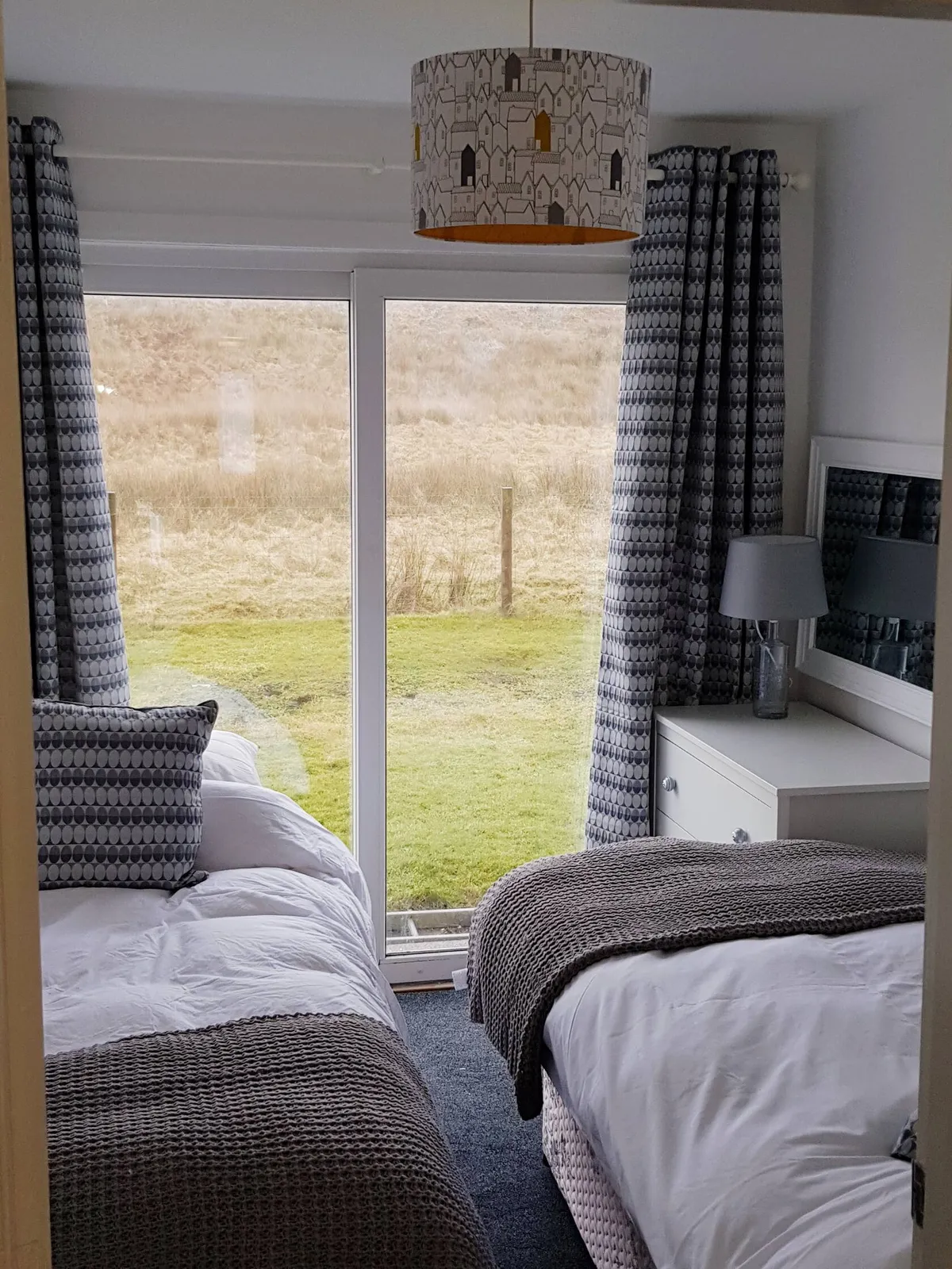 Bedroom 2 featuring twin single beds dressed in clean linens