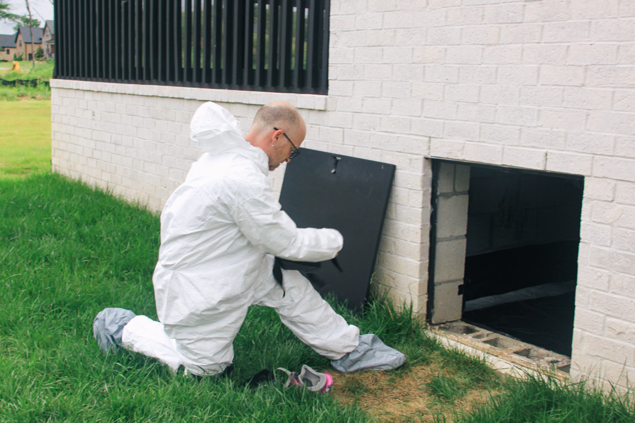 Inspector getting ready to examine the crawlspace