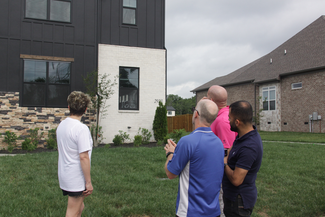 inspector explaining findings to a client on-site