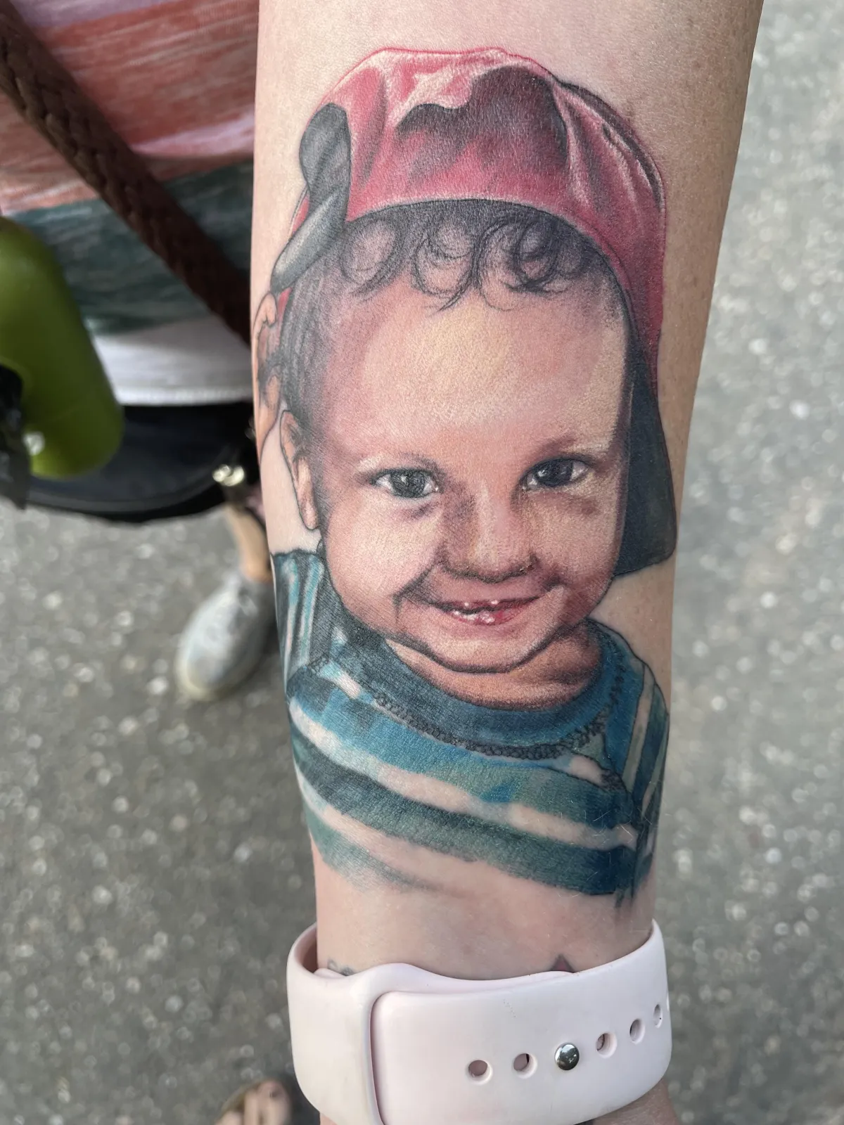 person in blue denim shorts and white nike sneakers standing on gray concrete floor
