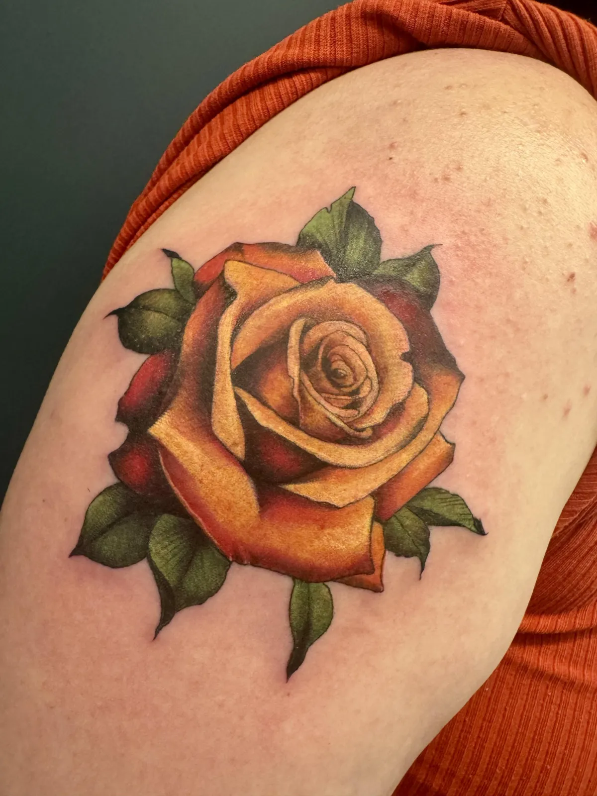 person with tattoo on right arm