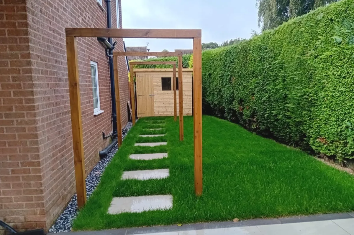 Landscaper in Old Trafford building a new garden wall and lawn