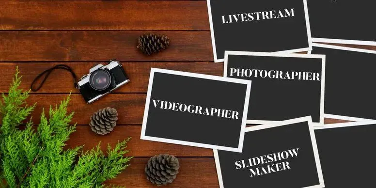 A flat lay of photography and videography equipment including a camera and various cards, for video slideshow and livestream services.