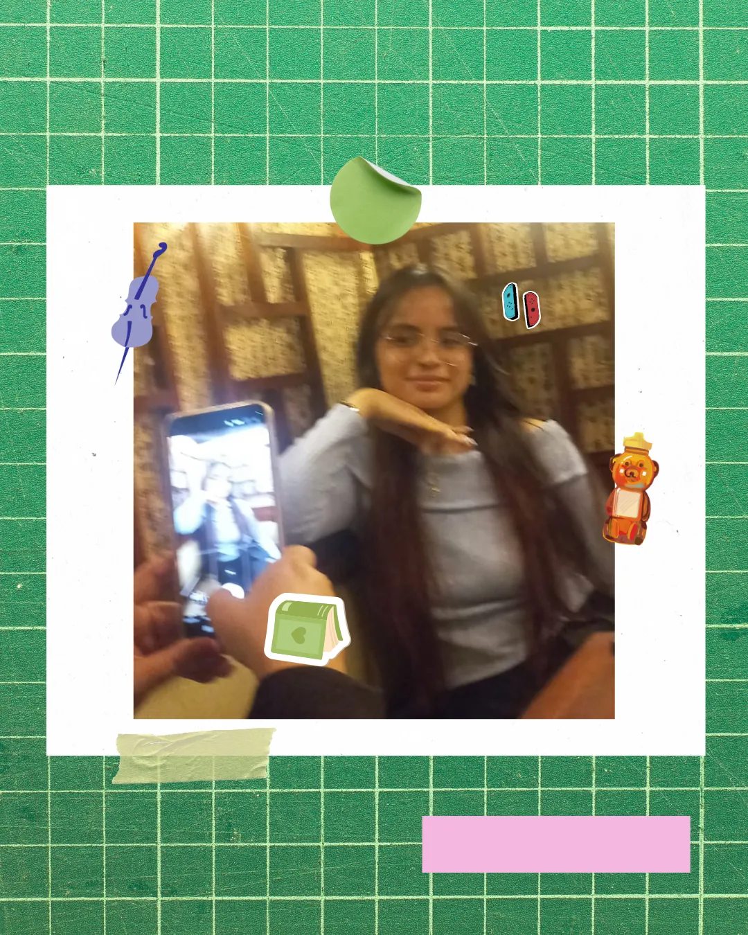 Polaroid-style photo of a person wearing a cap and dark jacket looking to the side, taped at the corners