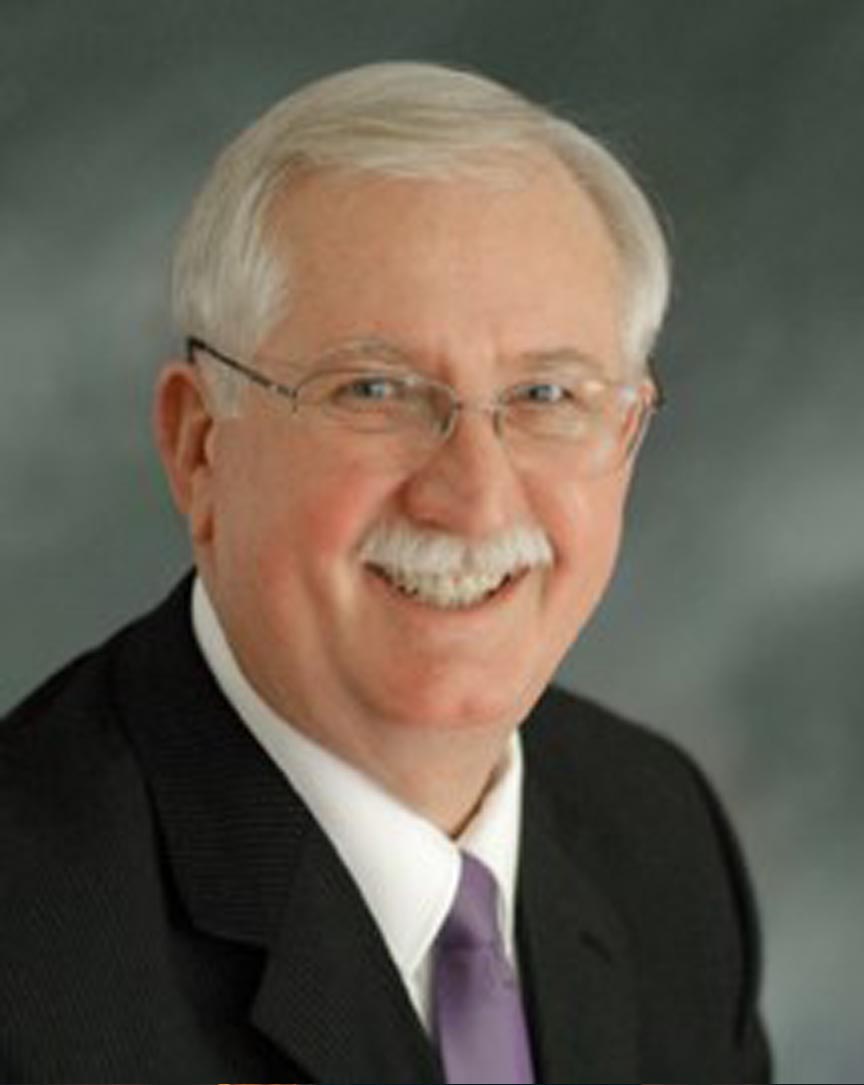 Don Claycomb outdoors in a professional, warm portrait