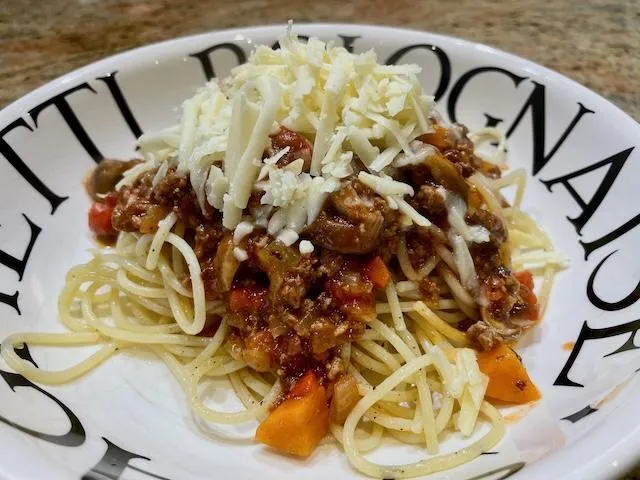 Spaghetti Bolognaise with cheese on top
