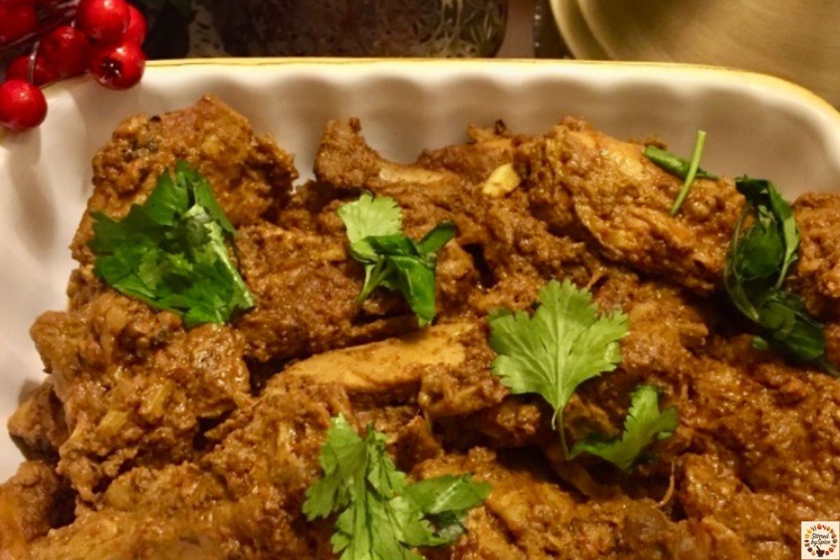 Mangalorean chicken ghee roast – chicken pieces in a fiery red masala and ghee.