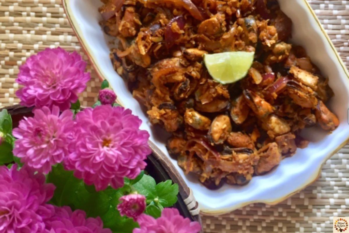 Mussel sukka — coastal Indian mussel stir-fry with coconut, curry leaves, and roasted spices.