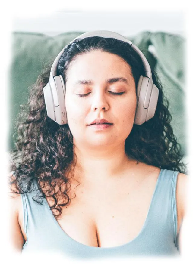 Woman wearing headphones, eyes closed