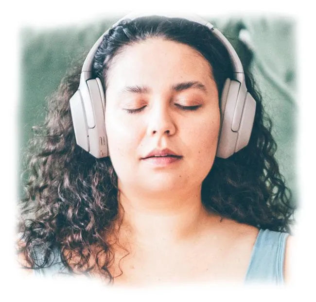 Woman wearing headphones, eyes closed