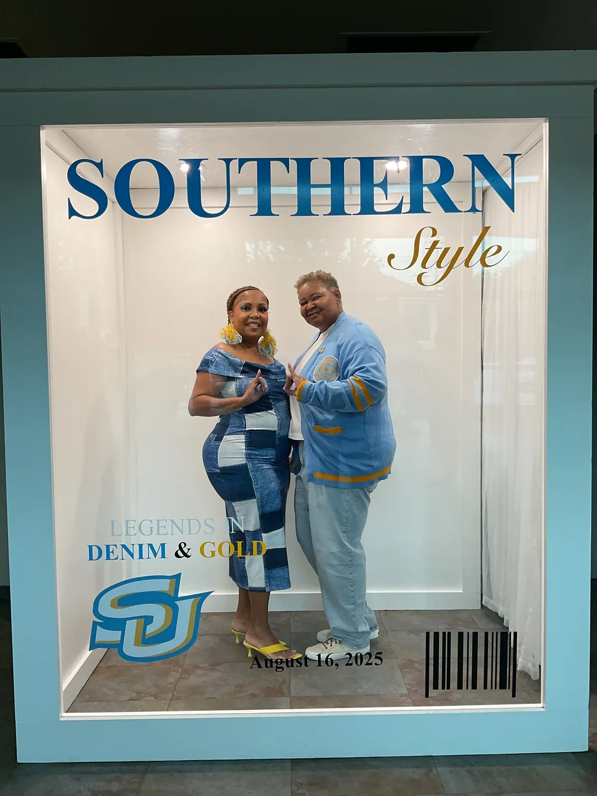 Couple posing inside a Southern Style magazine cover photo booth