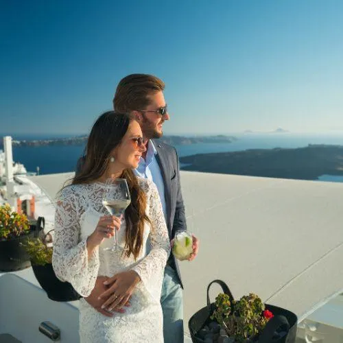 A couple standing on roof top