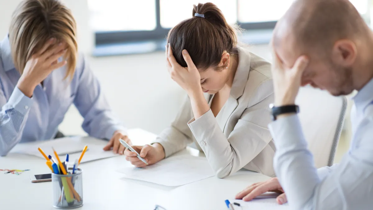 image of stressed sales team losing deals and not getting replies from their emails