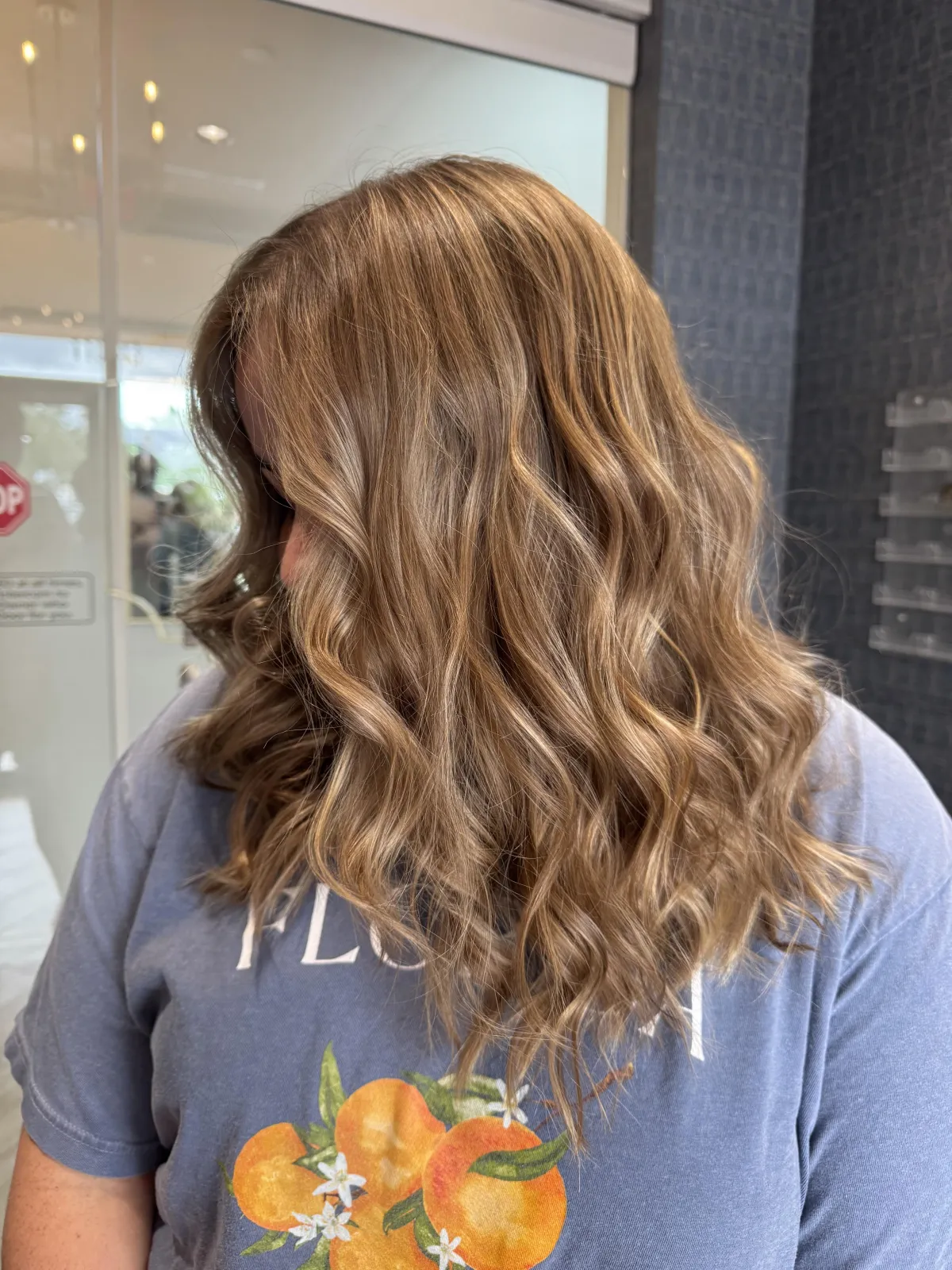 Beautiful brown hair with subtle blonde highlights. Waved and smoothed out. 