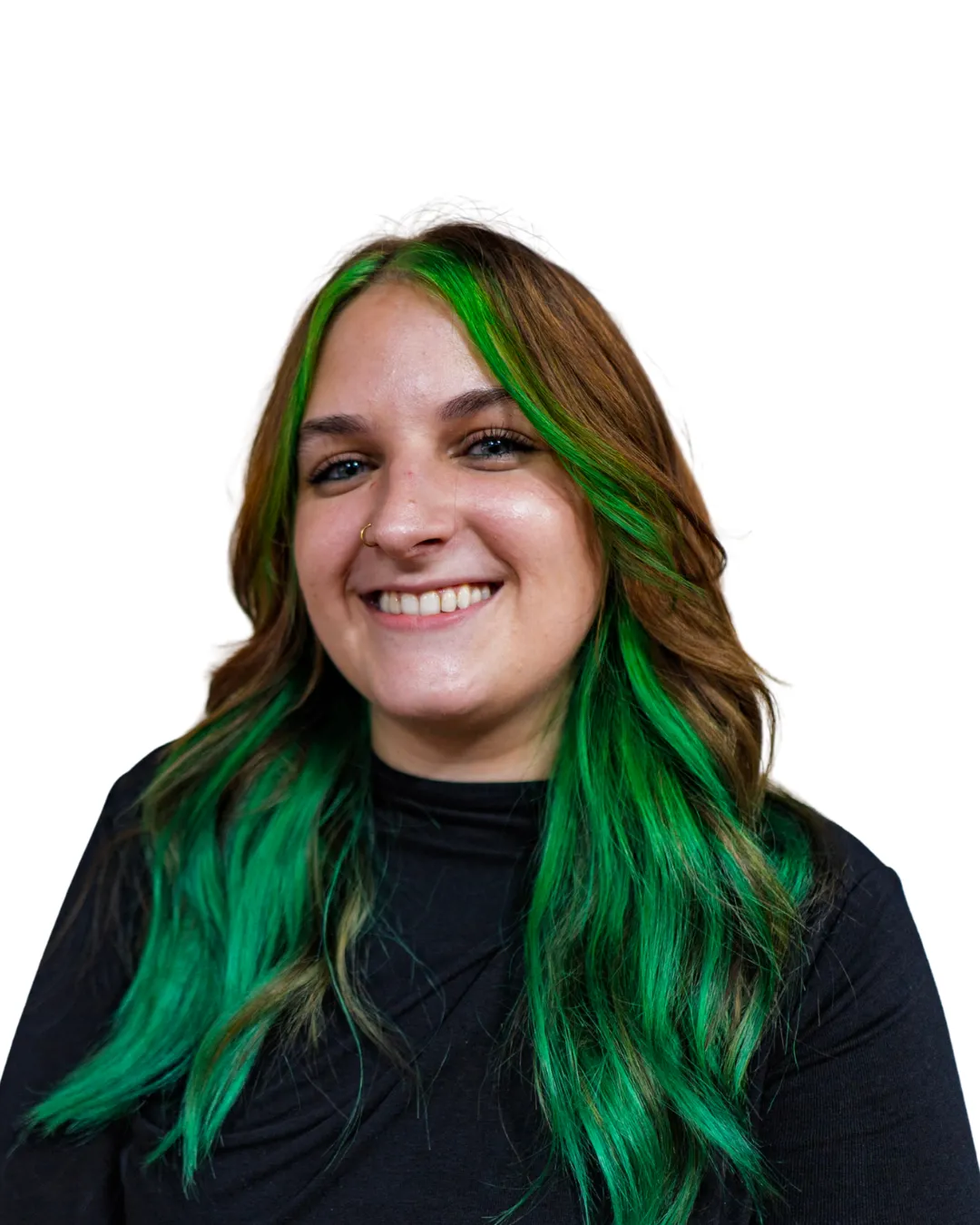 Creative hairstylist with long brown hair and bold green highlights smiling in a professional headshot at Avera Hair Studio in Ocoee, Florida.