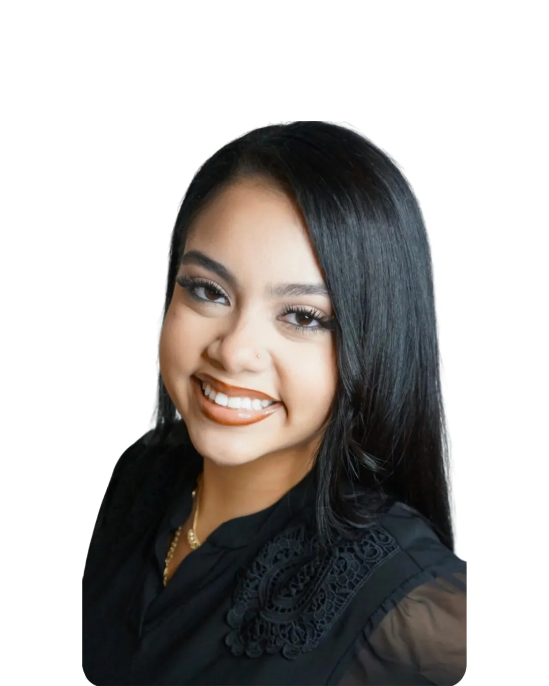 Female hairstylist with long straight dark hair and a bright smile in a professional headshot at Avera Hair Studio in Ocoee, Florida.