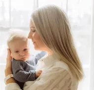 mom holding baby