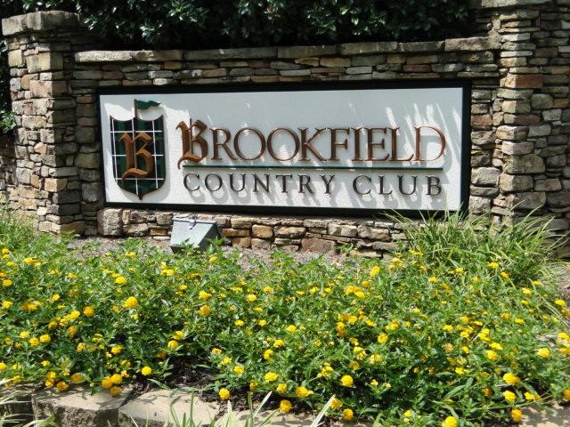 Roofer installing upscale shingle roof on home in Brookfield Country Club, Roswell GA
