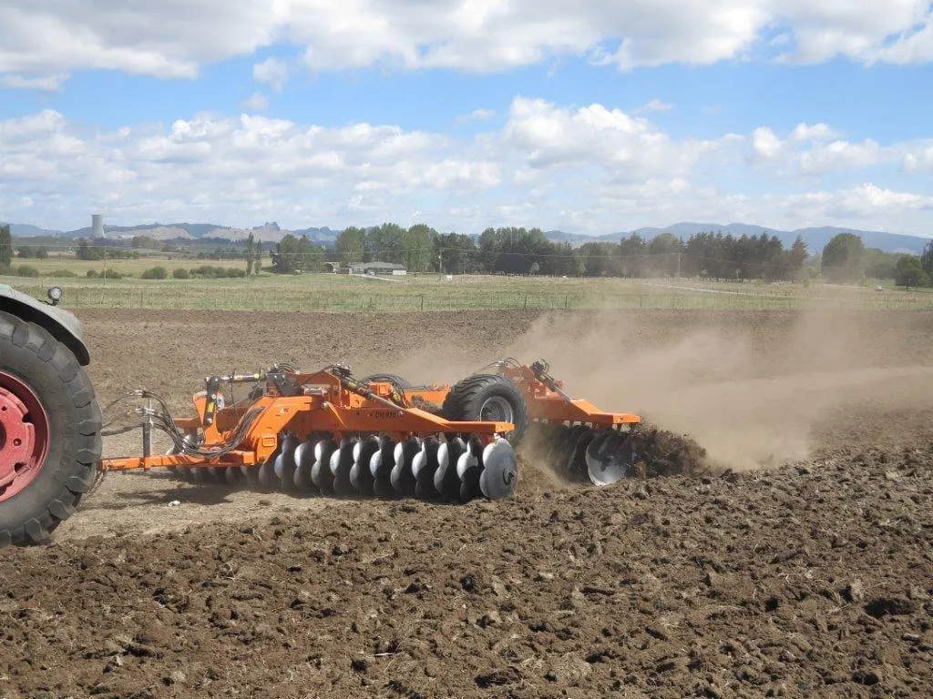 A&L Contracting NZ’s tractor with tillage equipment preparing land for farming in Taranaki