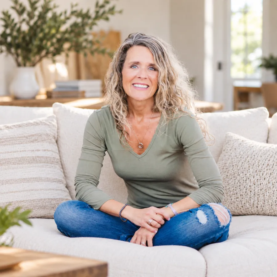 Sonya Eckel in a warm natural sanctuary setting, reflecting calm somatic presence