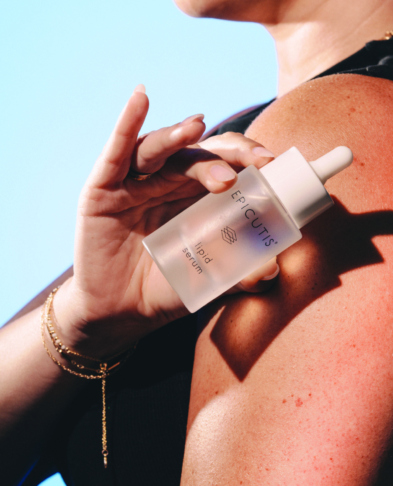 Epicutis Lipid Serum Bottle Held by Lady