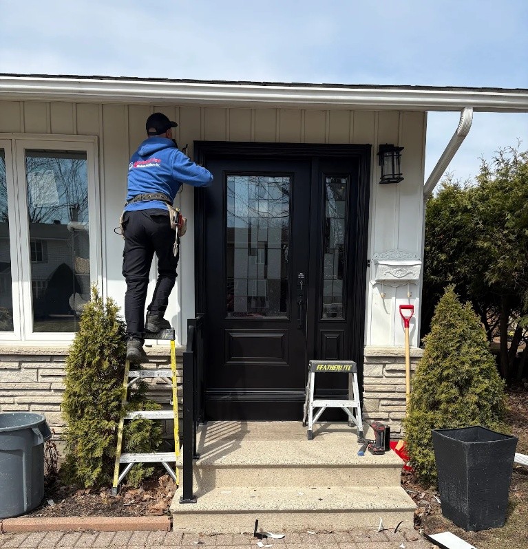 A stylish custom black entry door, expertly installed by the Advanced View team.