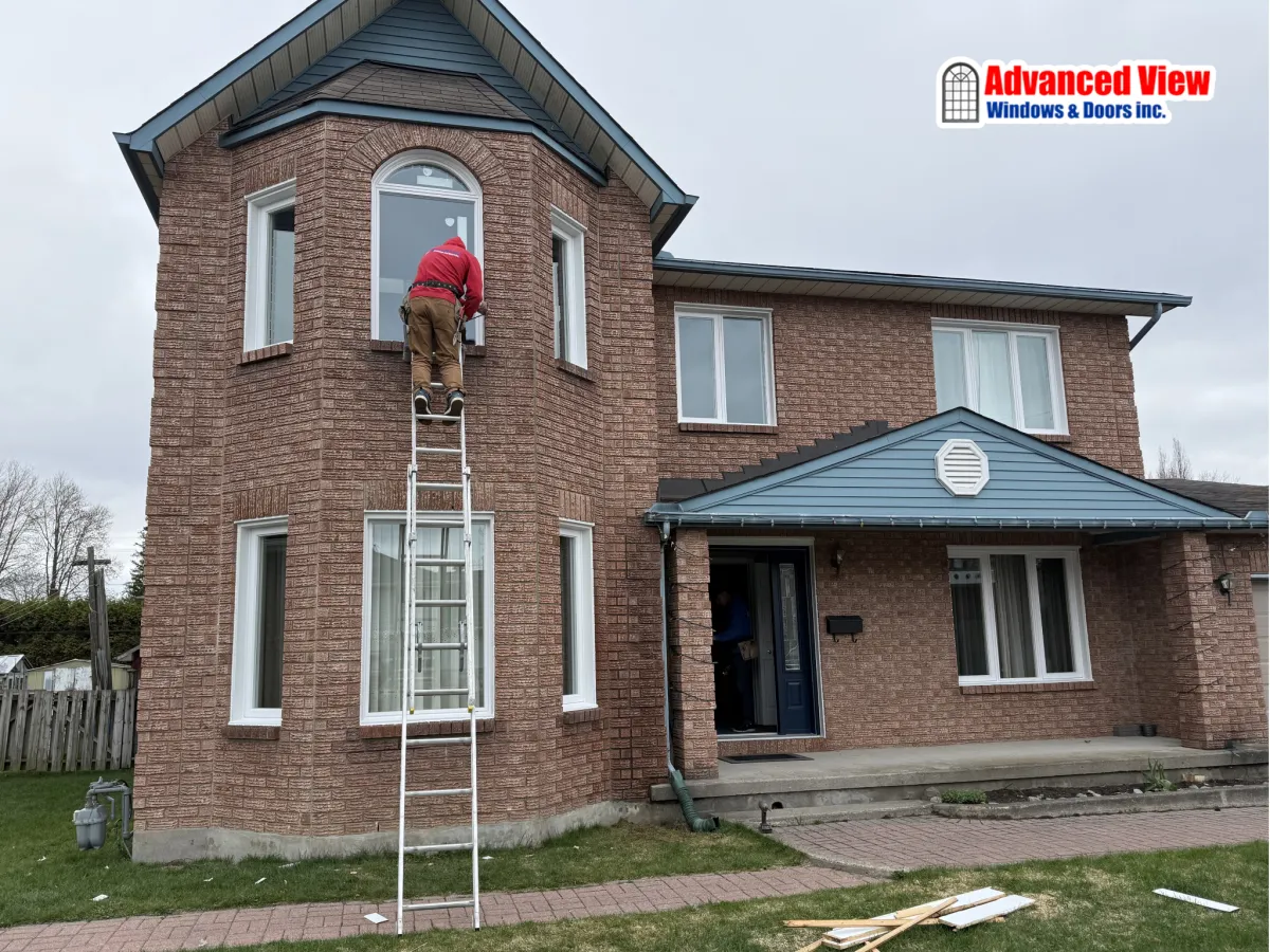 Expert window installation process by Advanced View Windows and Doors Inc. at a residential property.