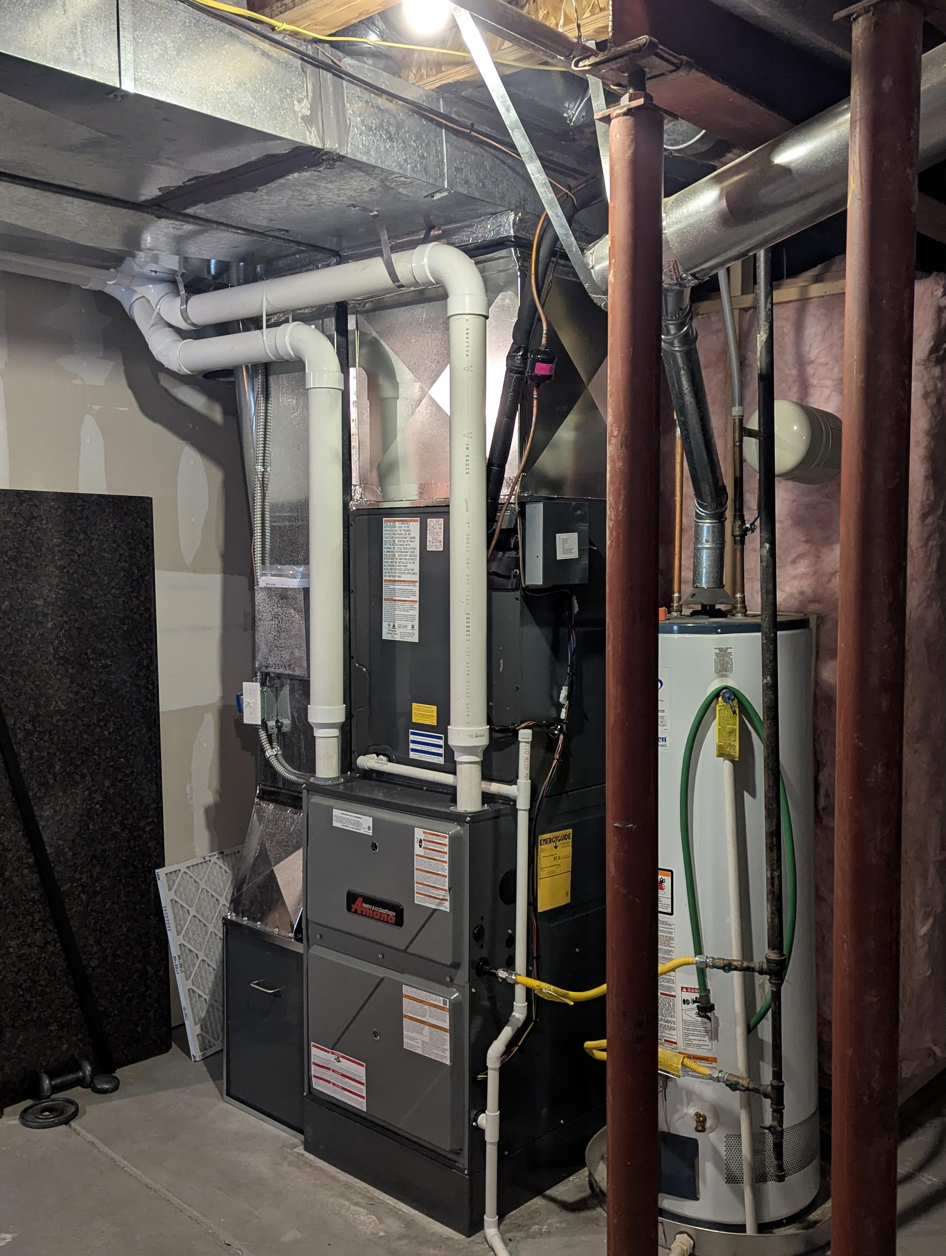 Furnace and water heater installation, code-compliant HVAC system in Topeka, Kansas.
