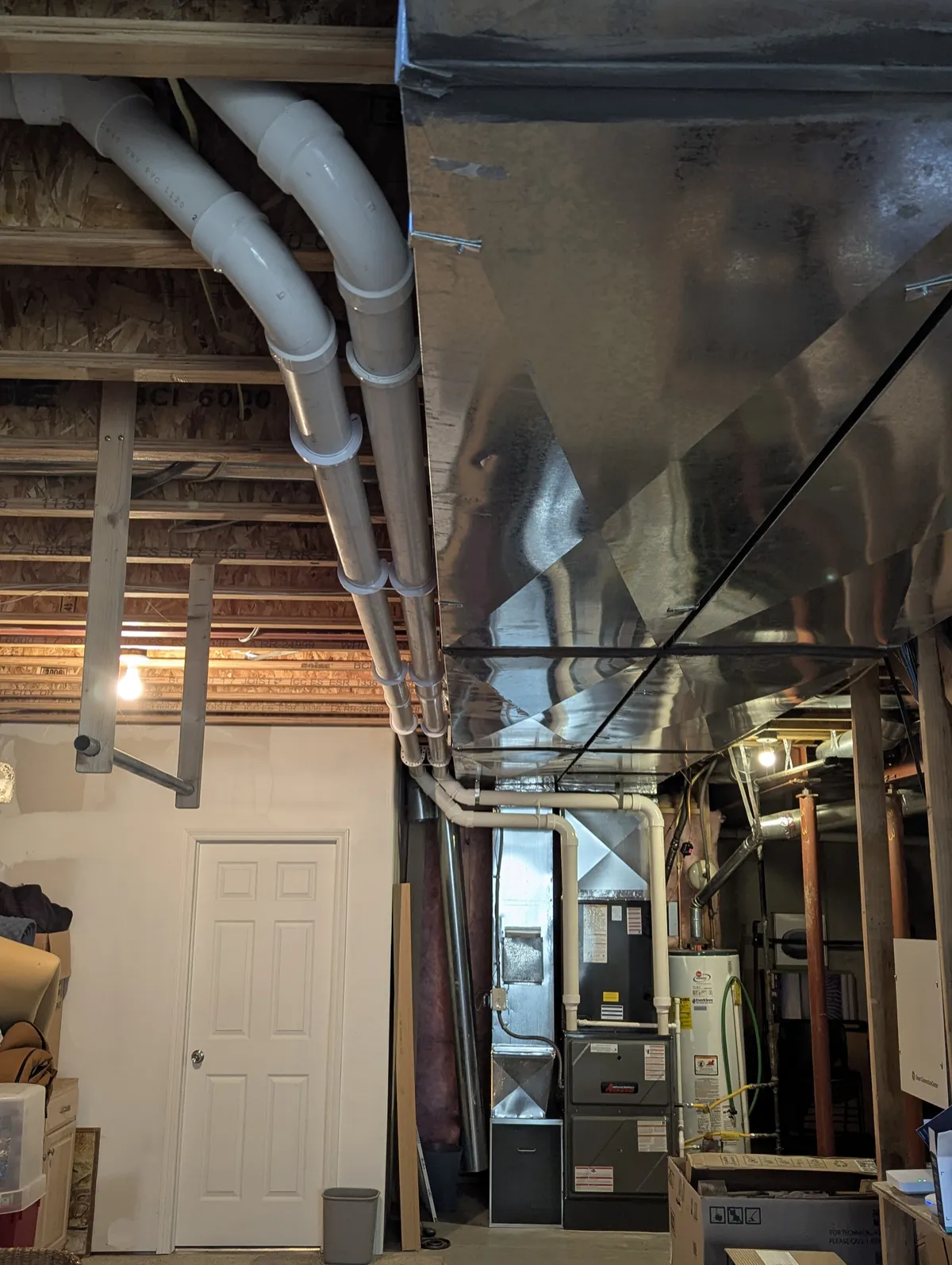 Furnace and water heater installation, code-compliant HVAC system in Topeka, Kansas.