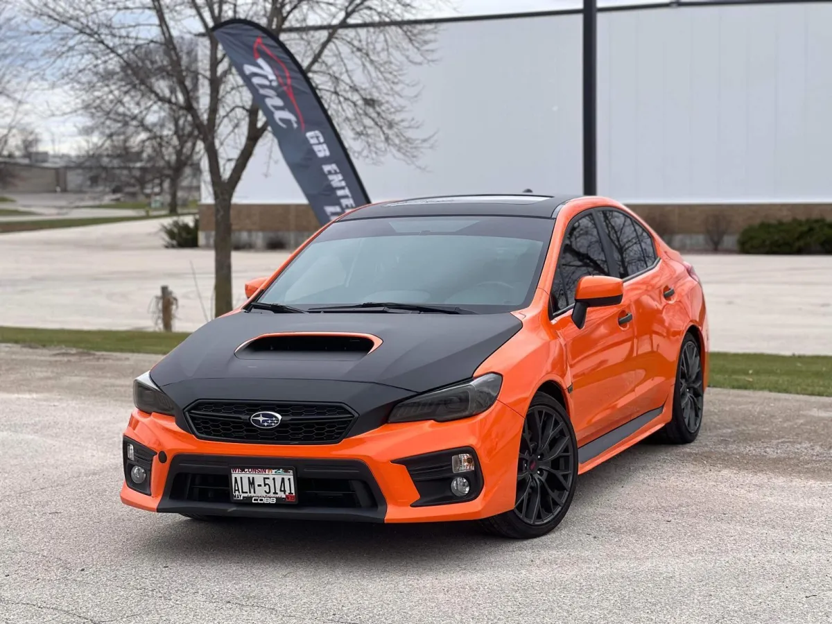 " Professional Led Lighting Installation service on a Toyota Corolla Orange and black hood by GB Enterprises AutoCare, located in Green Bay, WI . High-quality application on vehicle, demonstrating expert craftsmanship and attention to detail."