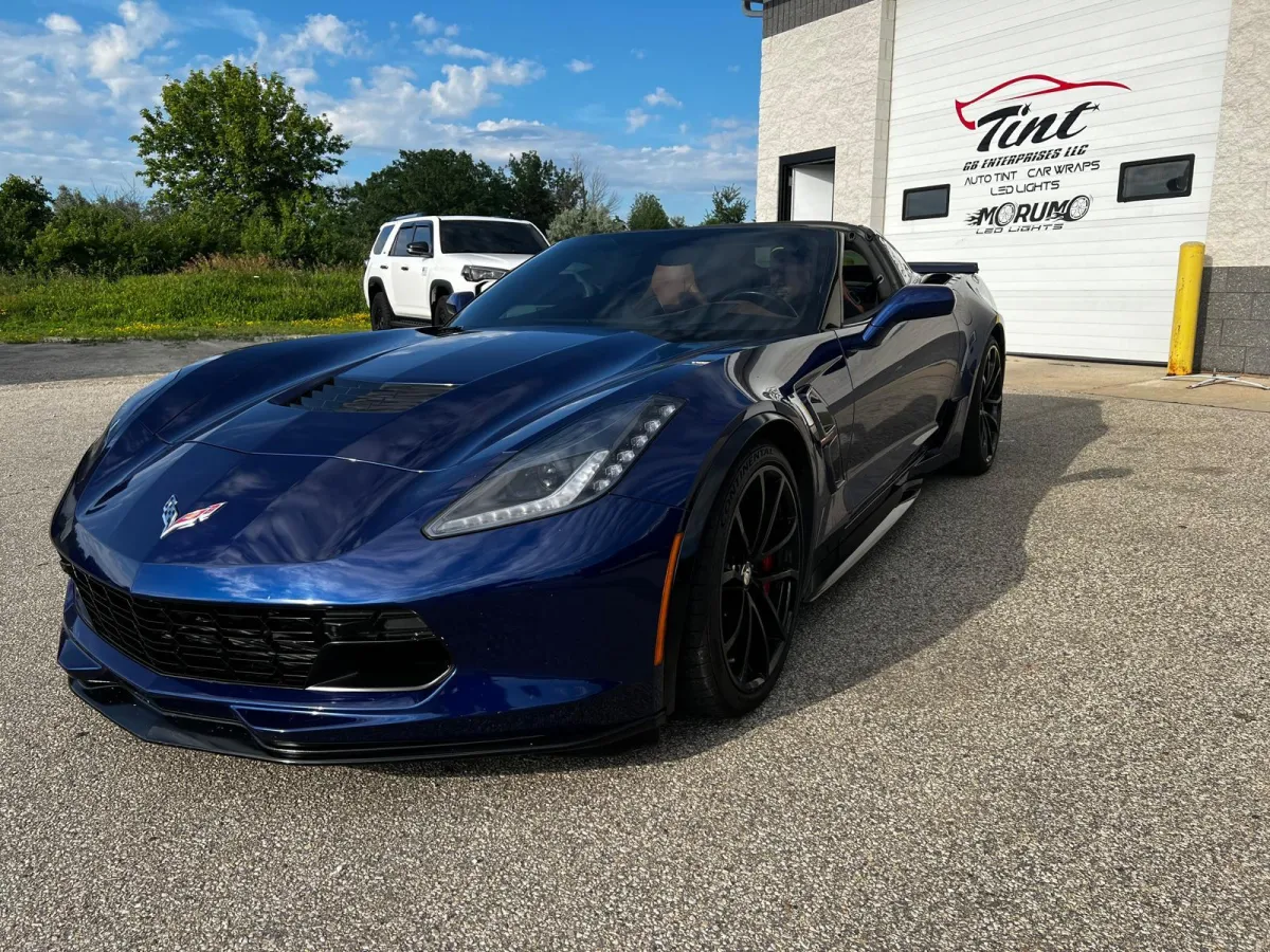 "Dark Metalic Blue Corvette with tinted windows, serviced at GB Enterprises AutoCare in Green Bay, WI. Featuring expert auto tinting and detailing services for enhanced performance and appearance."