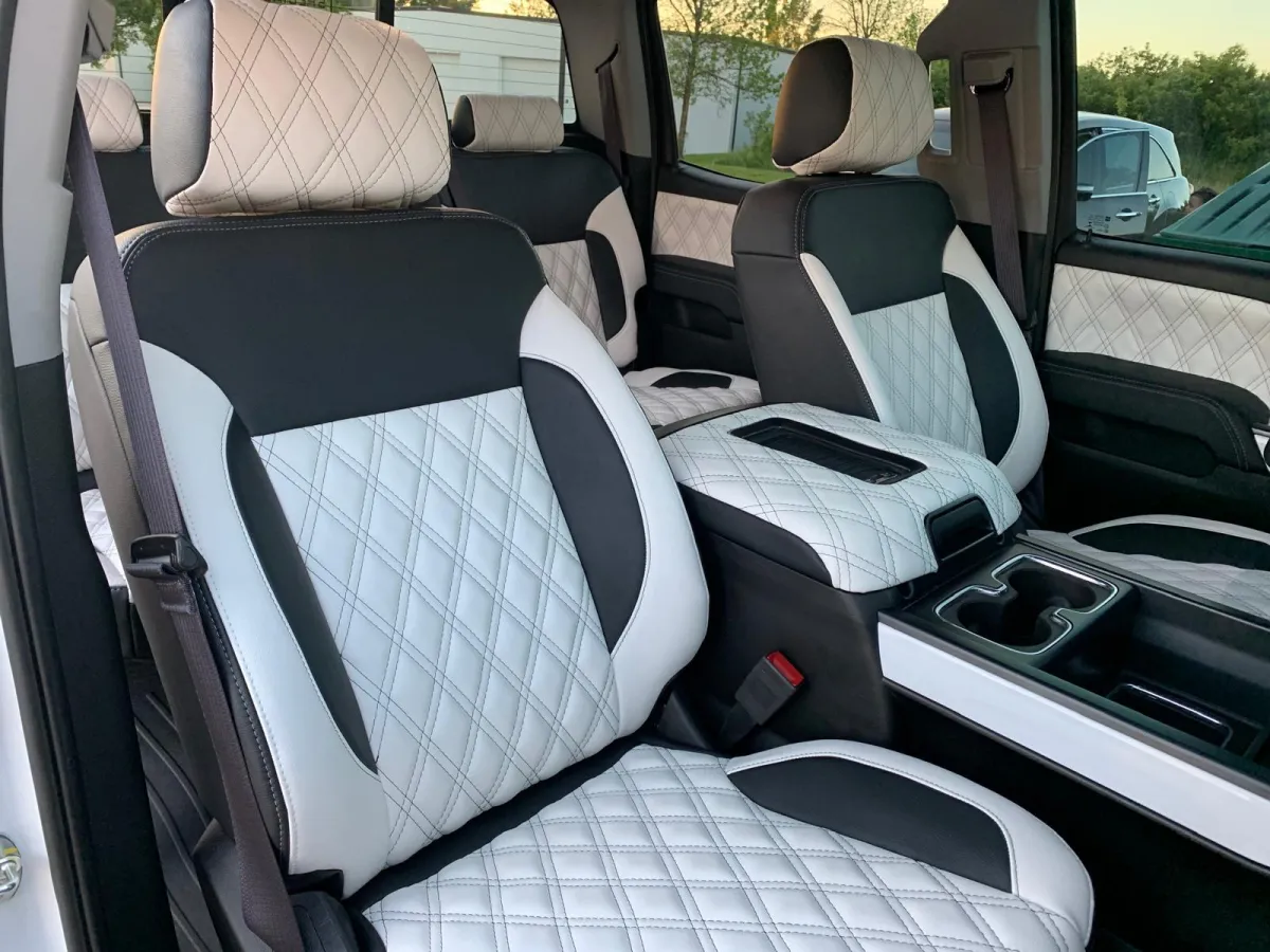 " Professional Upholstery Installation service on a Dodge Ram White Color Color by GB Enterprises AutoCare, located in Green Bay, WI . High-quality application on vehicle, demonstrating expert craftsmanship and attention to detail."