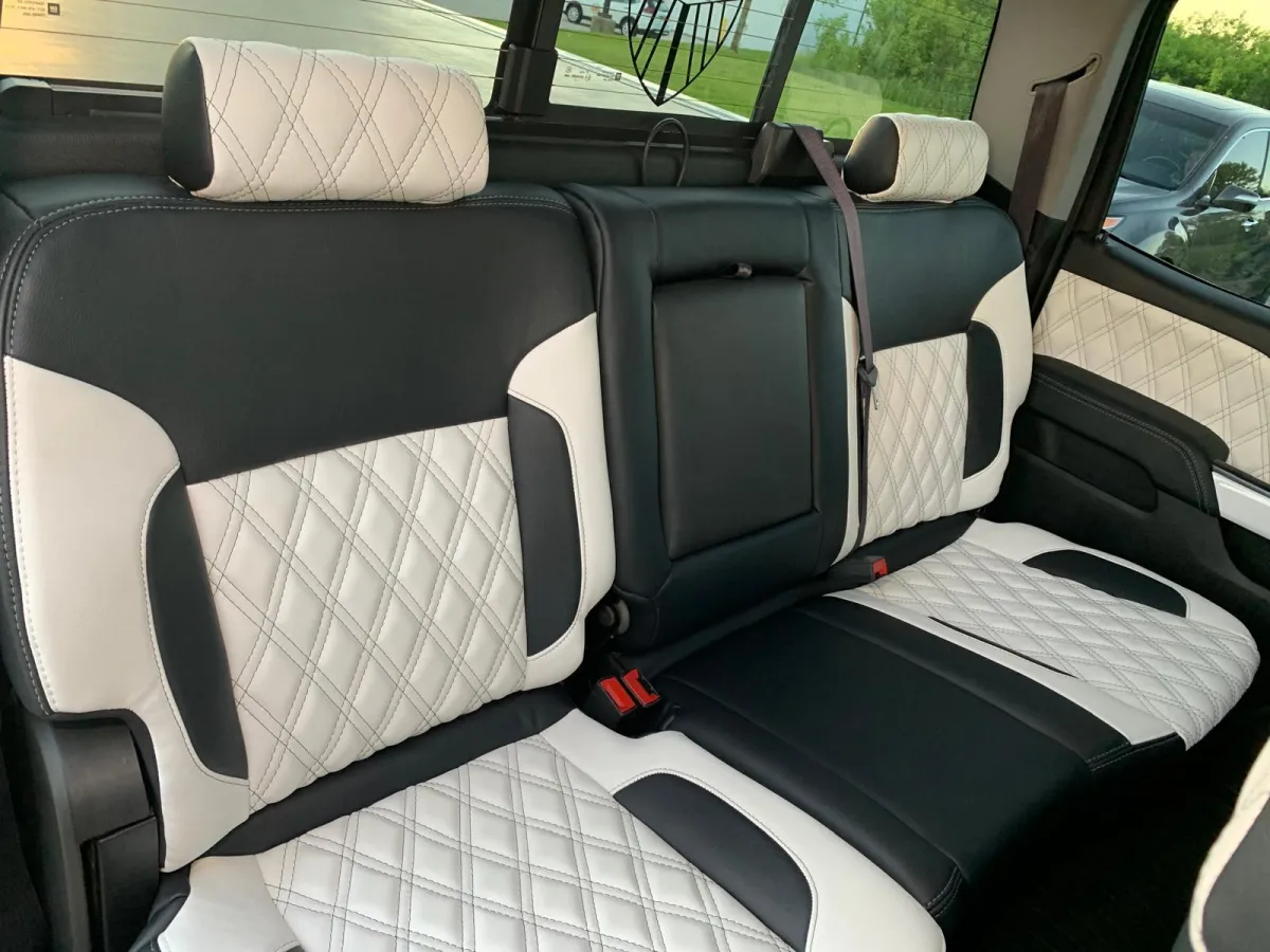 " Professional Upholstery Installation service on a Dodge Ram White Color by GB Enterprises AutoCare, located in Green Bay, WI . High-quality application on vehicle, demonstrating expert craftsmanship and attention to detail."